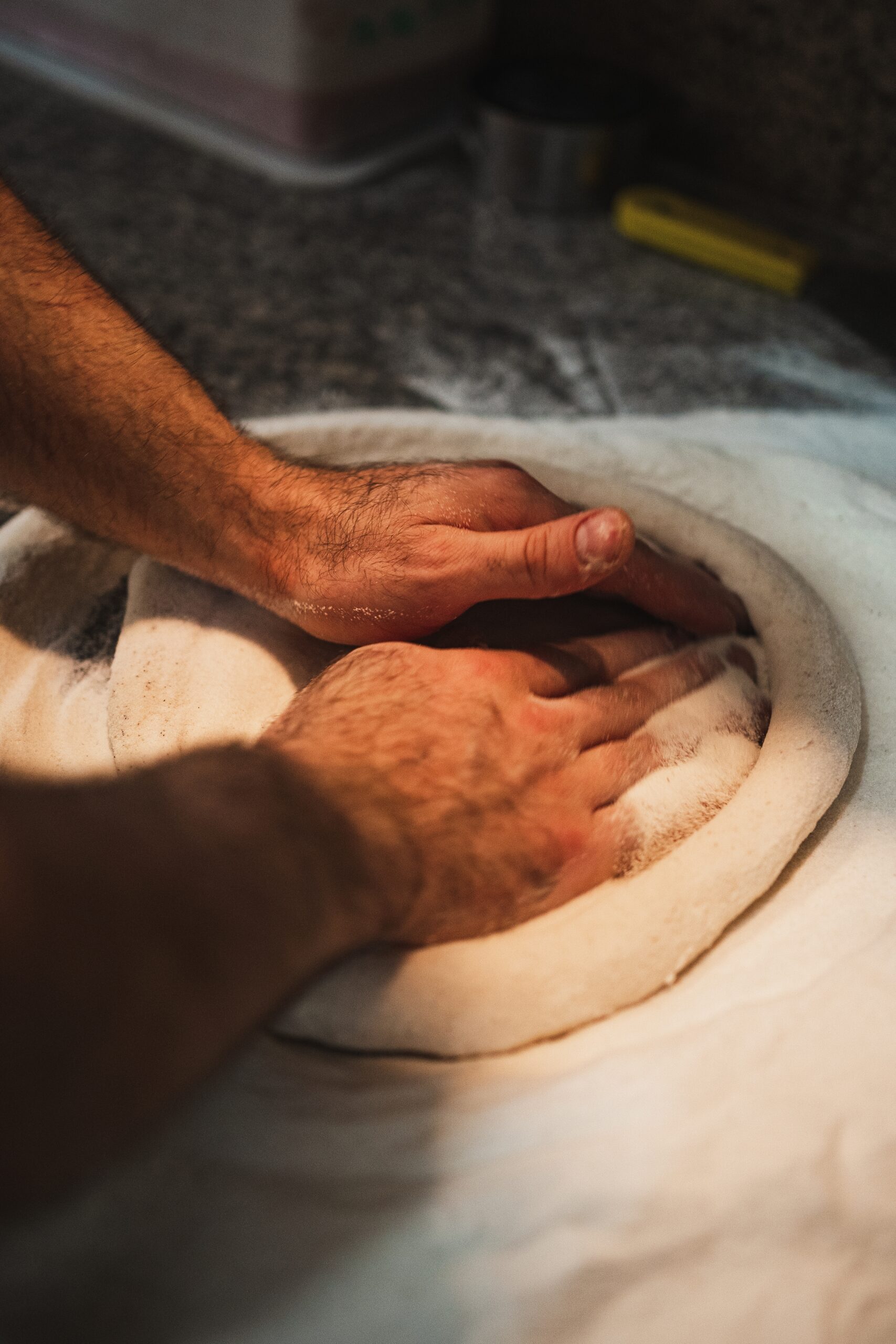 Close,Up,Of,Cooks,Hands,Kneading,Pizza,Dough,In,Traditional